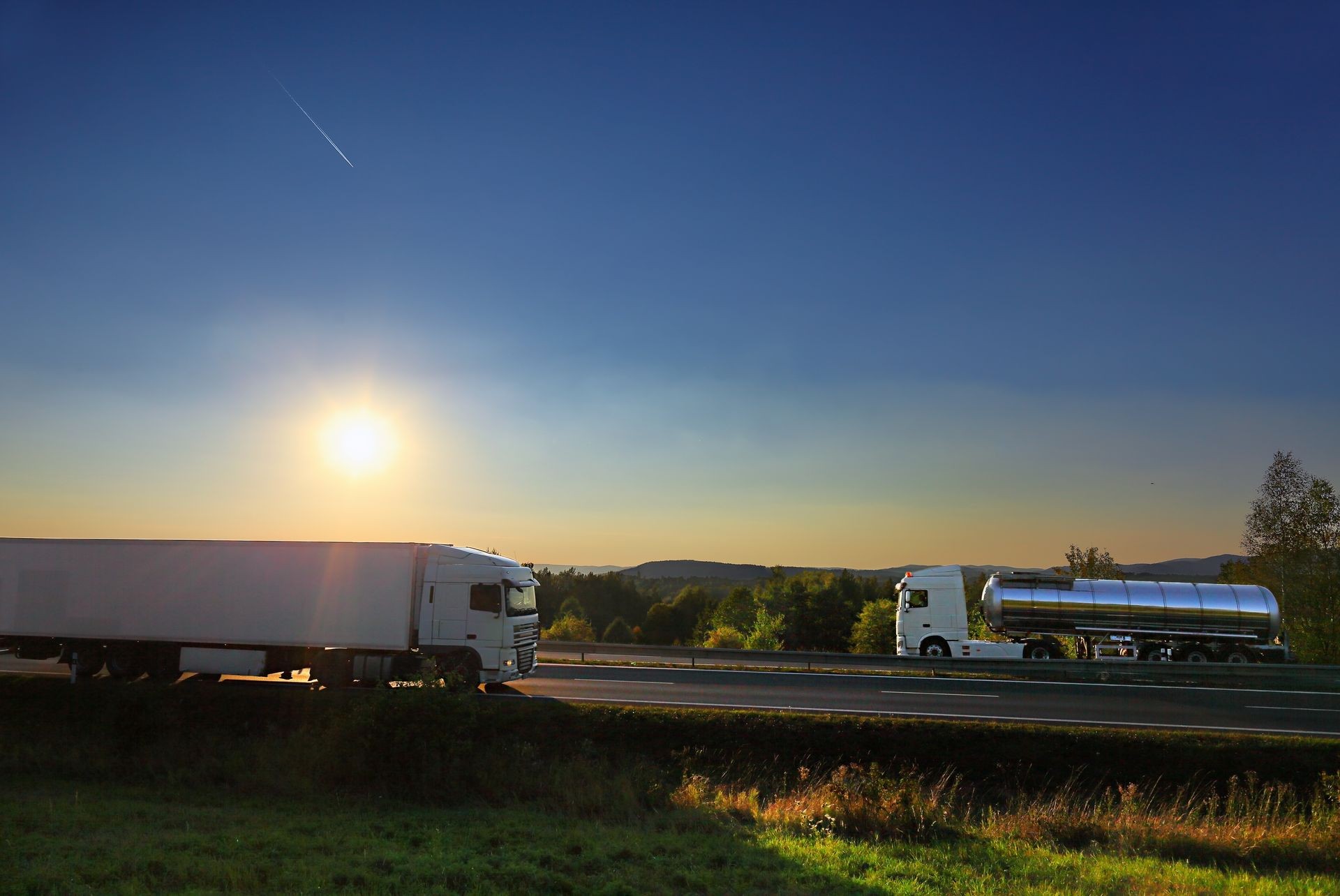 Truck transportation on the road at sunset Truck transportation on the road at sunset